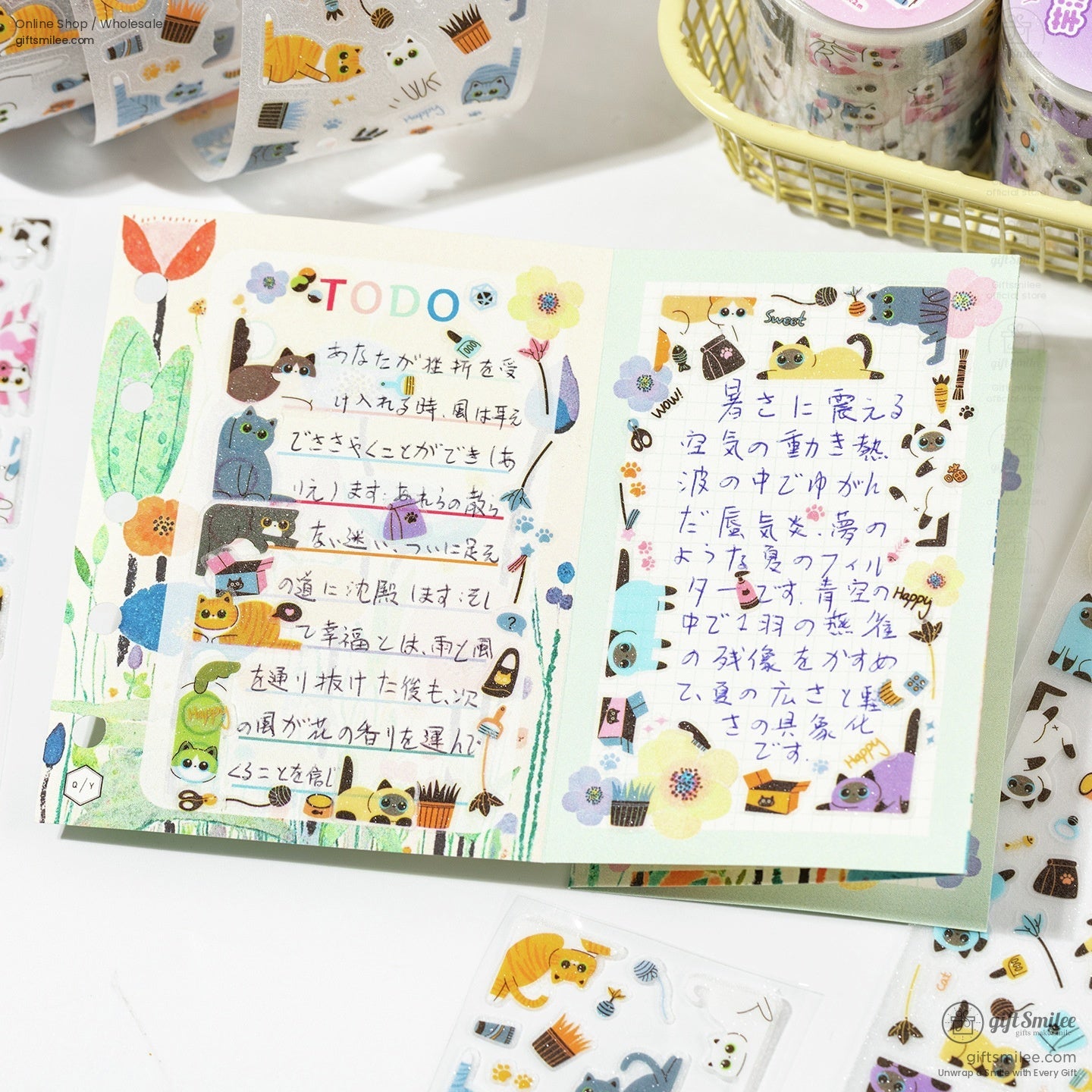 Journal decorated with kawaii cat washi tape, featuring vibrant designs and floral motifs