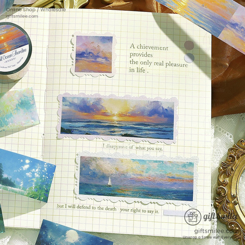 Artistic washi tape displayed on vintage stationery, showcasing ocean, sky, and field designs