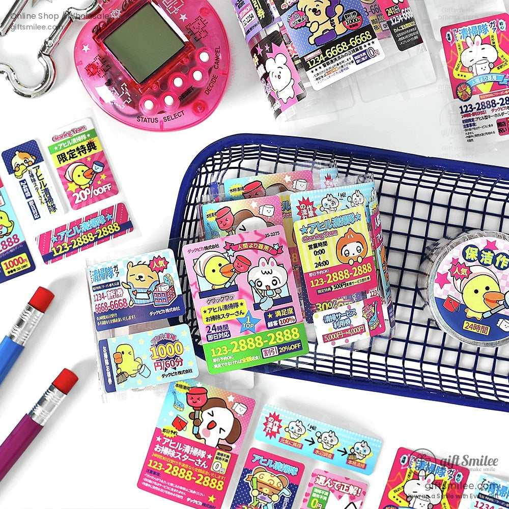 A basket filled with Japanese cartoon stickers and a pink digital toy on the side