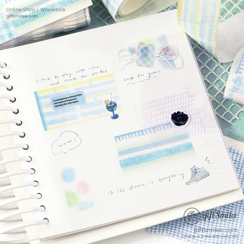 Creative scrapbook page decorated with pastel patterned washi tape in candy and plaid themes