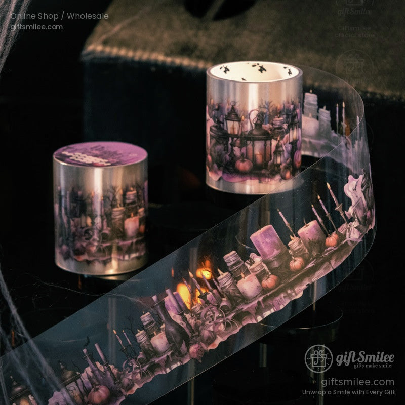 Gothic washi tape with purple and candlelit designs unfurled on a black surface