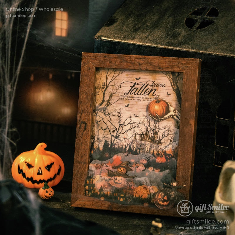 Framed Halloween-themed art featuring pumpkins, a haunted forest, and spooky text