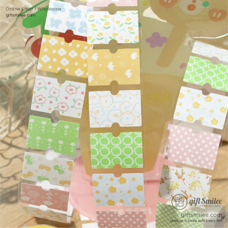 Close-up of decorative washi tape strips with vibrant patterns including flowers, leaves, and geometric designs
