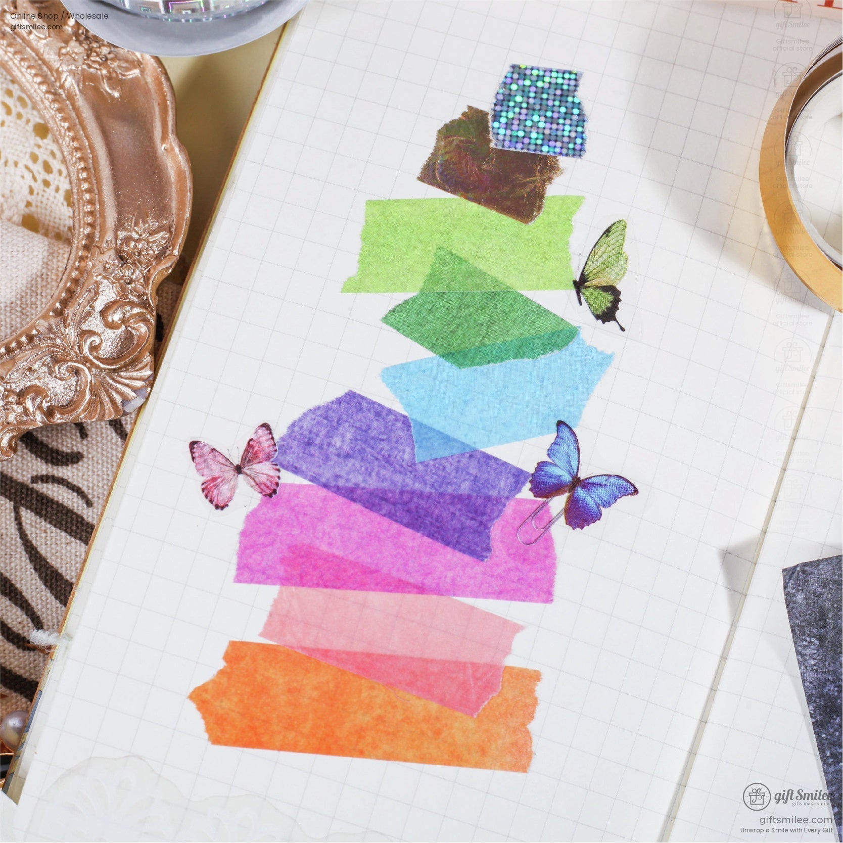 Journal decorated with colorful washi tape strips and butterfly stickers