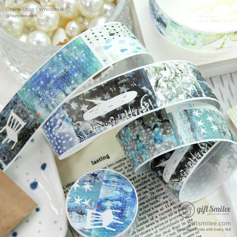 Blue and green patterned washi tape rolls with starry night and abstract art designs for crafting