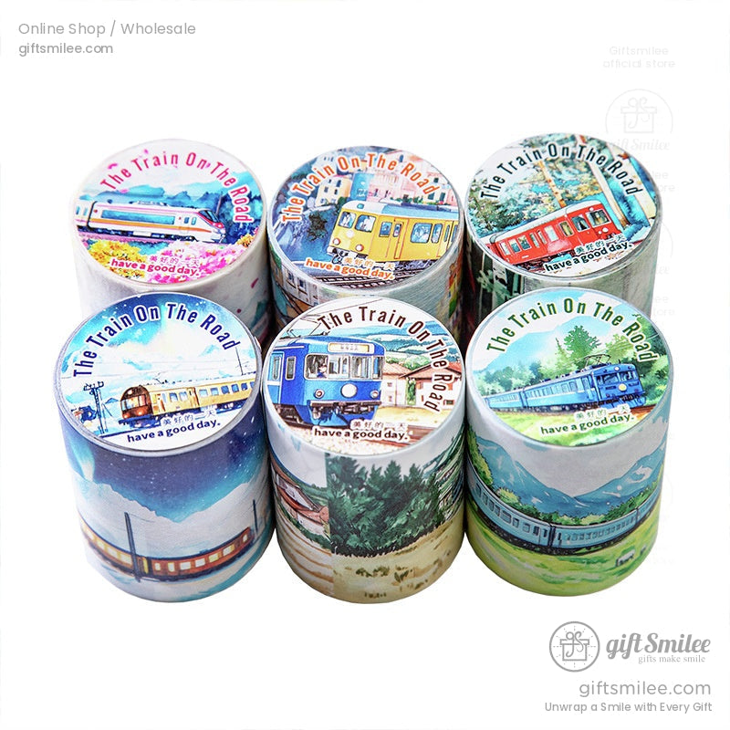 A set of six washi tape rolls, showcasing different train designs and scenic railway themes