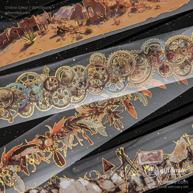 A detailed view of washi tape strips with desert landscapes, ruins, and intricate steampunk patterns