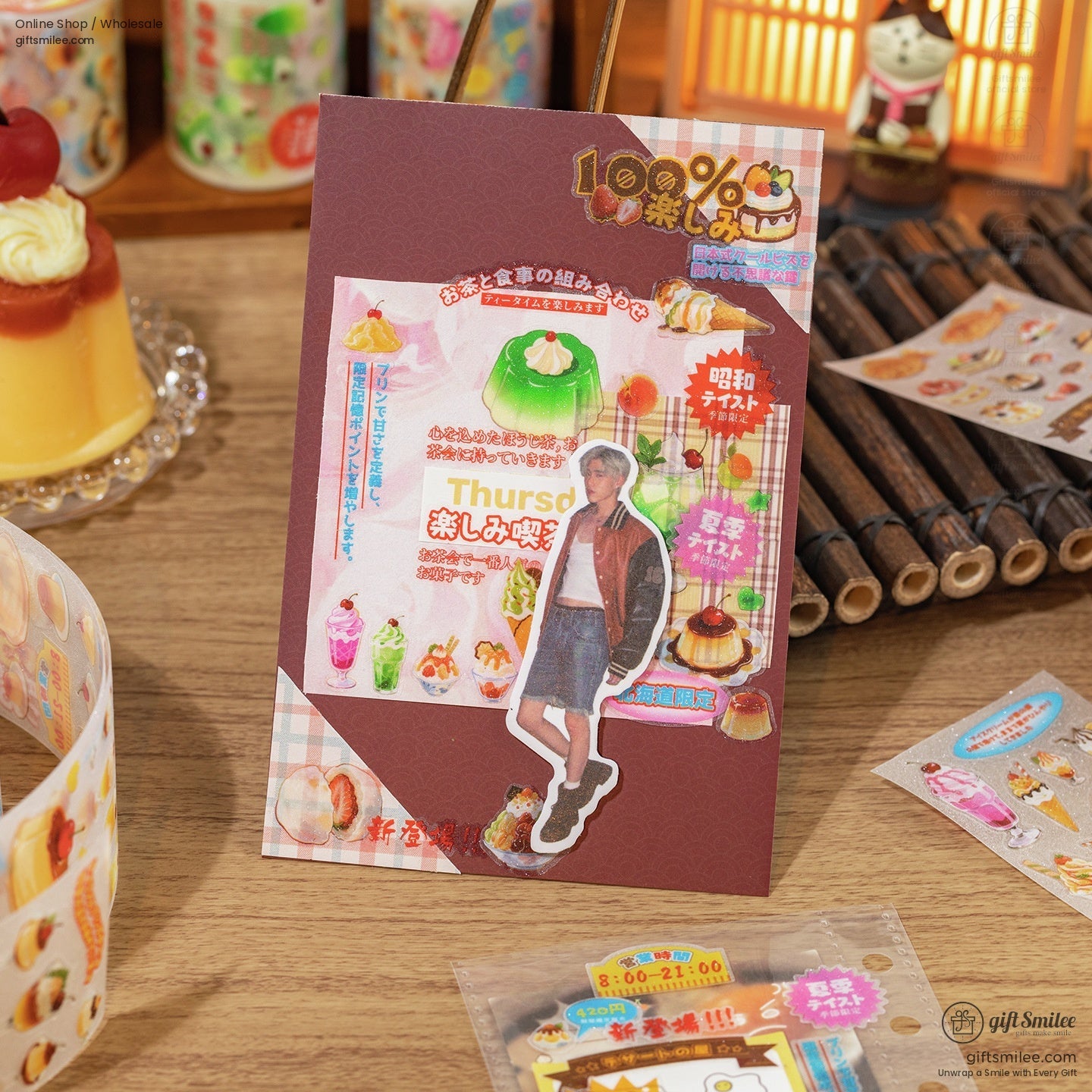 Scrapbooking scene with dessert-themed stickers and glittery tape roll