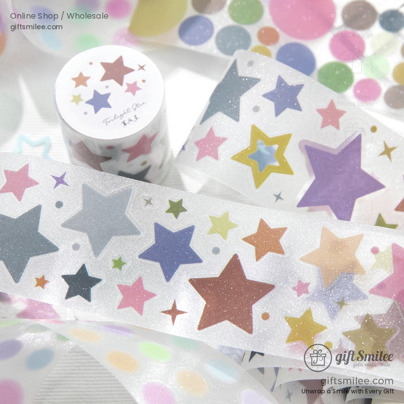 Star-patterned washi tape roll with holographic glitter design