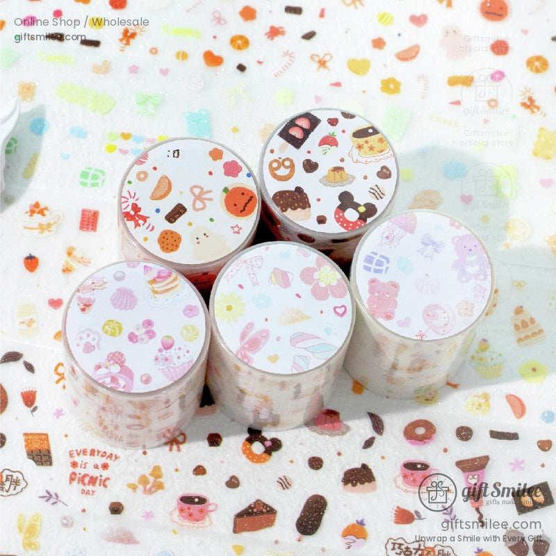Close-up of kawaii food-themed washi tape with donuts, chocolates, and pastel sweets