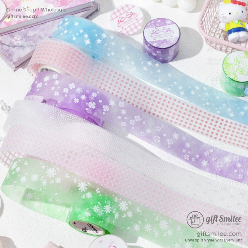 Multicolor floral and starry washi tape rolls displayed with decorative props