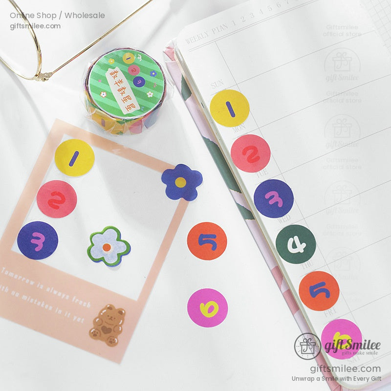 Decorative rainbow stickers and washi tapes styled in a planner for aesthetic journaling