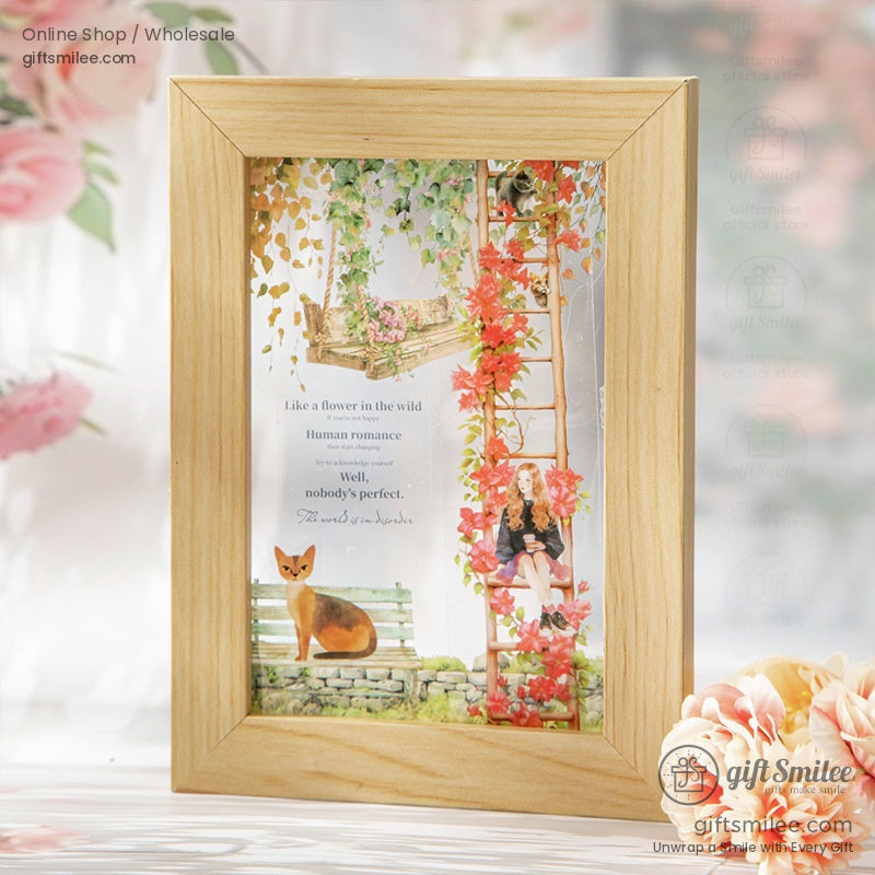Framed decorative washi tape art featuring red and green floral ladders, a fox, and charming characters