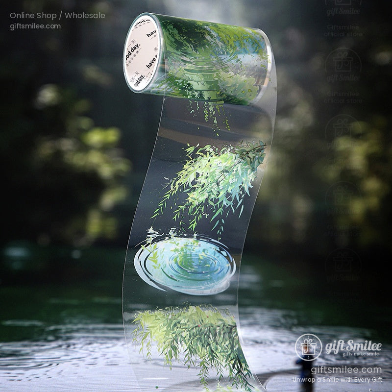 Transparent washi tape roll with a serene nature scene of rippling water and lush greenery