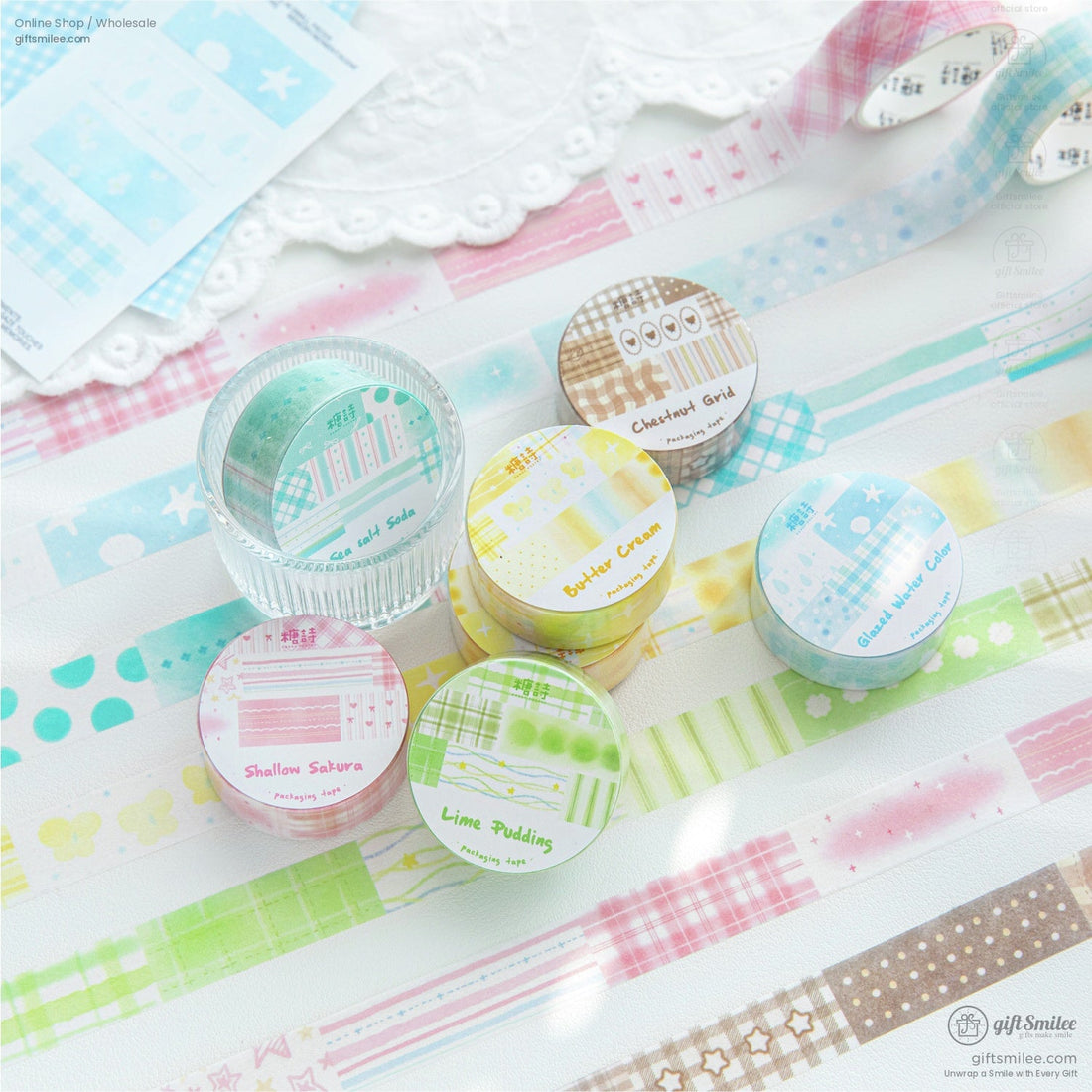 Pastel-themed washi tape set in various colors and patterns displayed on a lace background