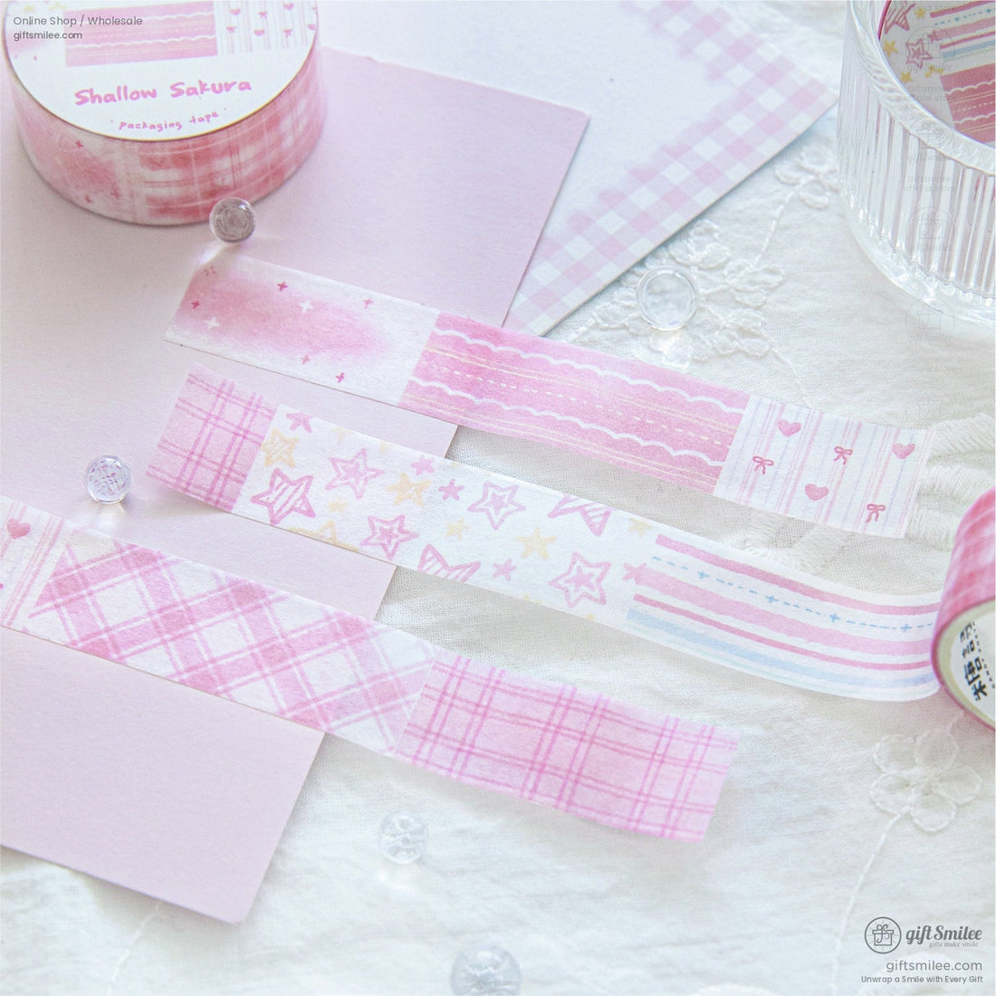Pastel-themed washi tape set in various colors and patterns displayed on a lace background