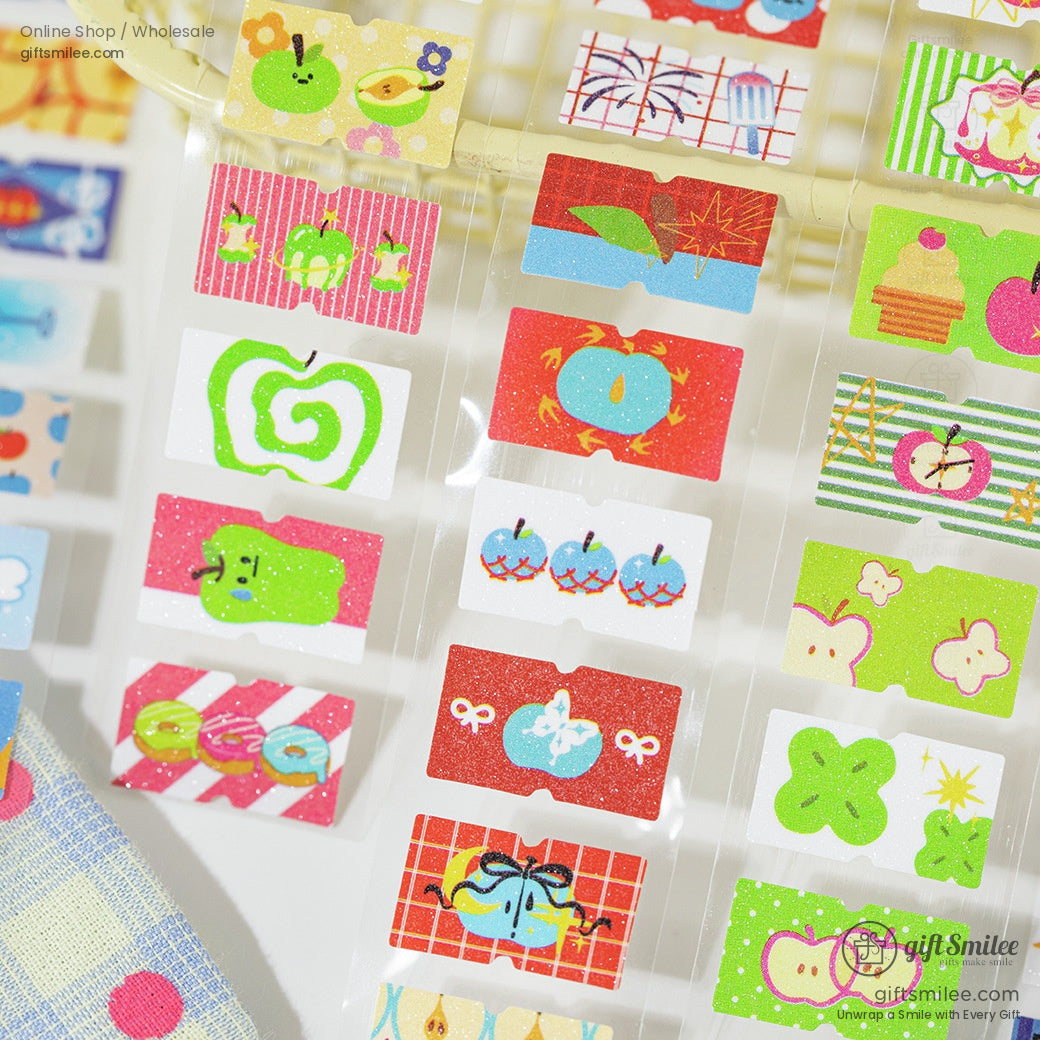 Close-up of apple and nature-themed glitter washi tapes for scrapbooking