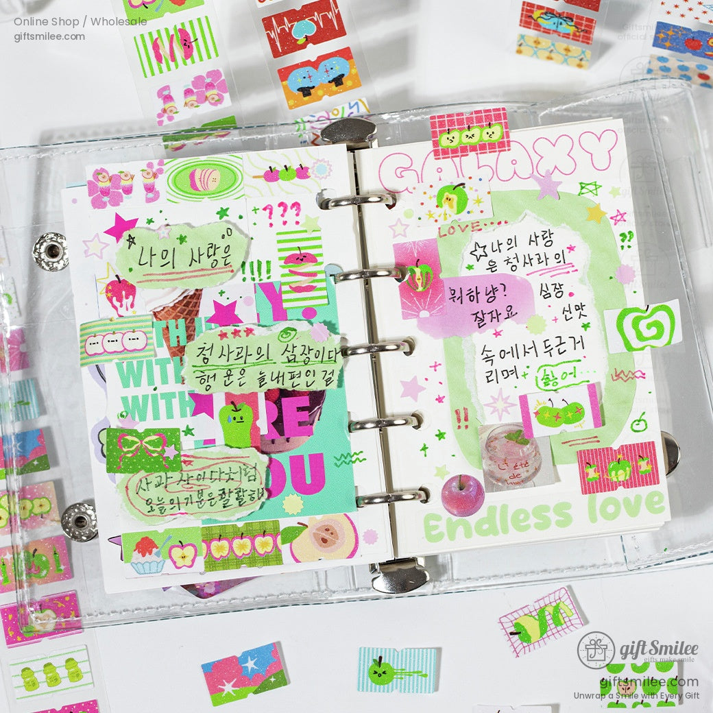 Open planner decorated with fruit-themed kawaii washi tape stickers