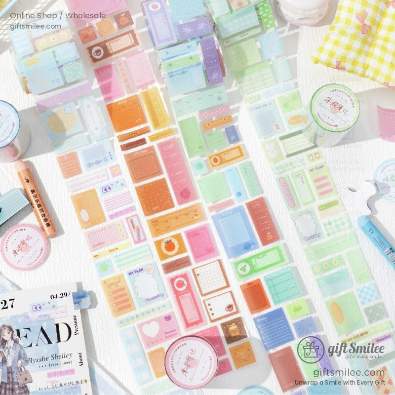Close-up of colorful washi tape rolls with decorative designs for journaling and crafting
