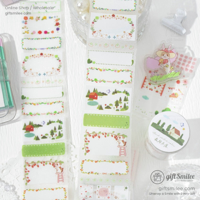 Green and nature-inspired washi tape rolls featuring trees, strawberries, and cottages