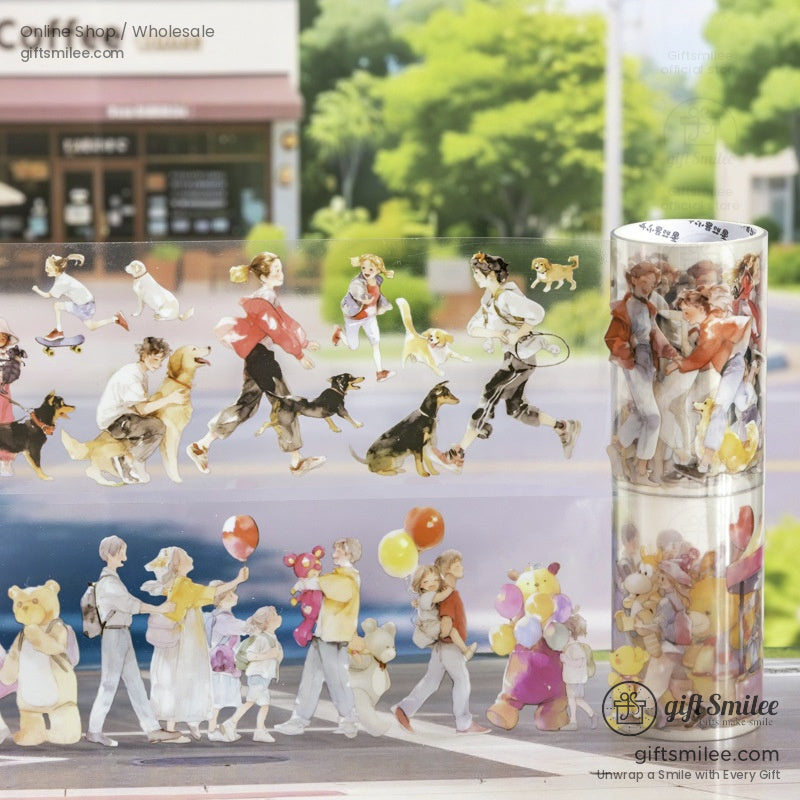 A roll of watercolor washi tape featuring people walking dogs in a park with a coffee shop in the background