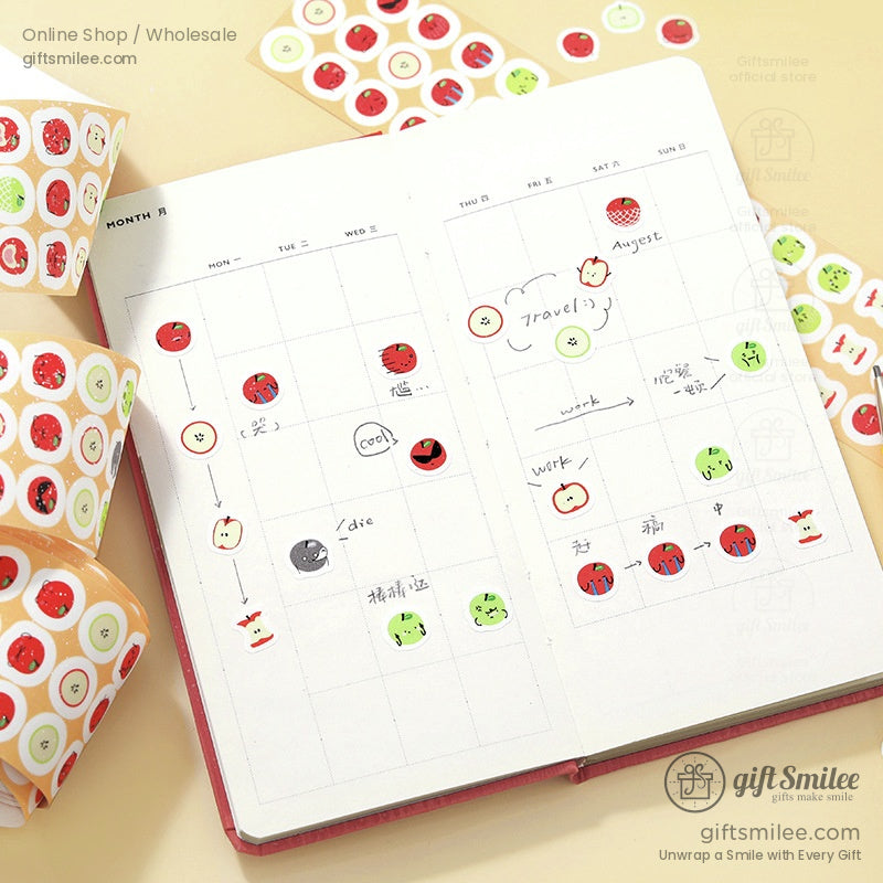 Journal decorated with apple, strawberry, and orange stickers from washi tape rolls