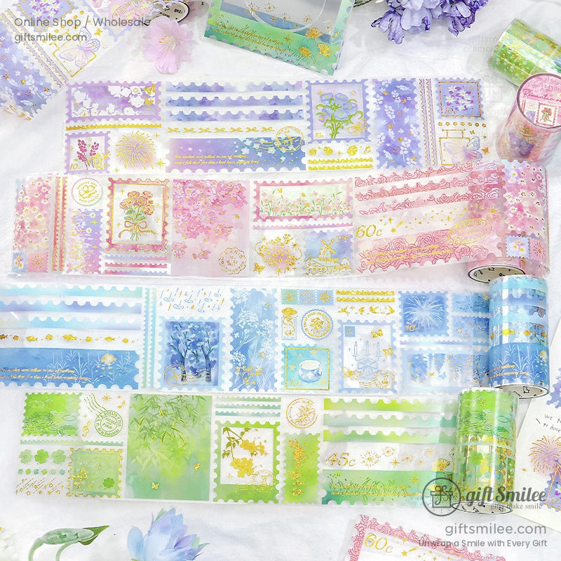 A vibrant collection of floral and vintage-themed washi tape rolls with gold foil accents, perfect for crafts and journaling