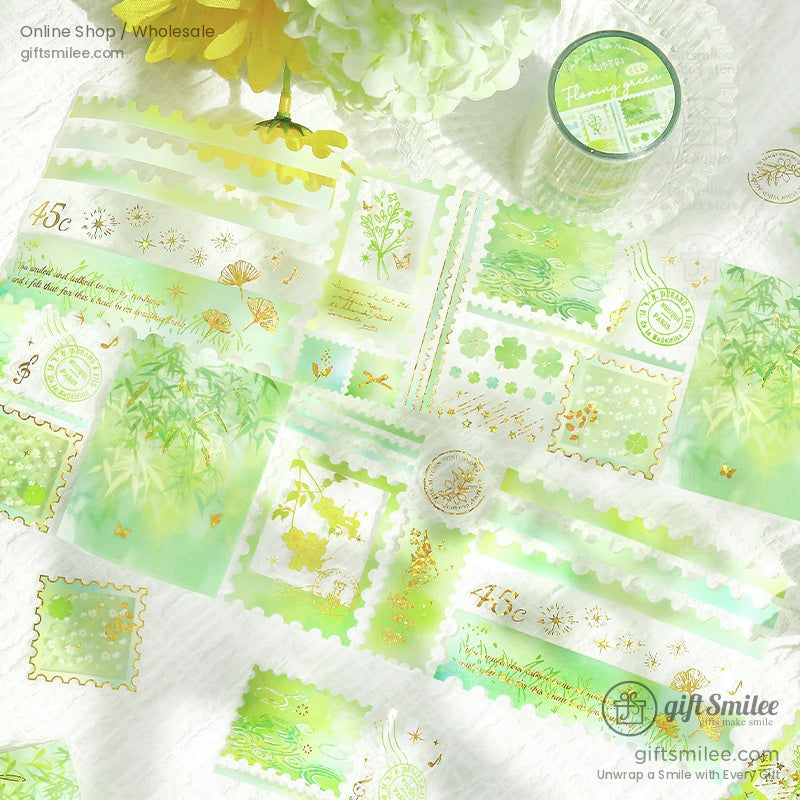 Green-themed washi tape with botanical patterns and delicate gold foil details, beautifully displayed with flowers