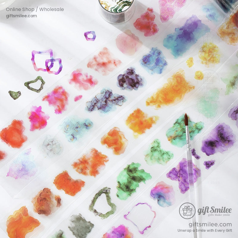 Vibrant watercolor washi tape rolls with abstract patterns, perfect for crafts