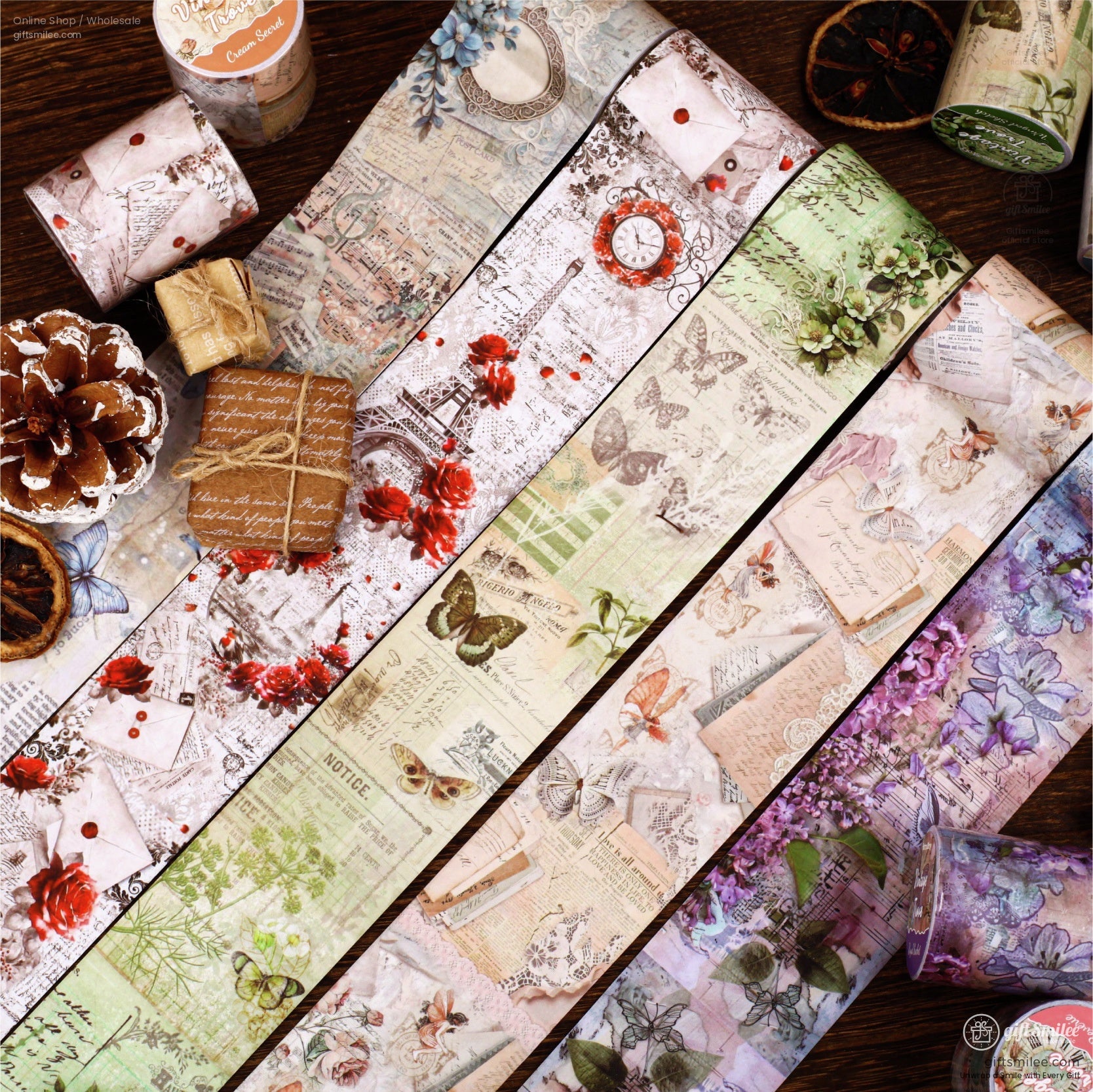 Close-up of vintage floral and butterfly-themed washi tape rolls arranged on a wooden surface