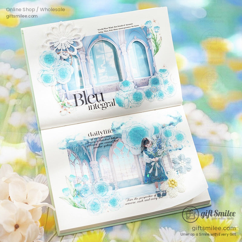 Open scrapbook with blue floral designs and window-inspired art collage