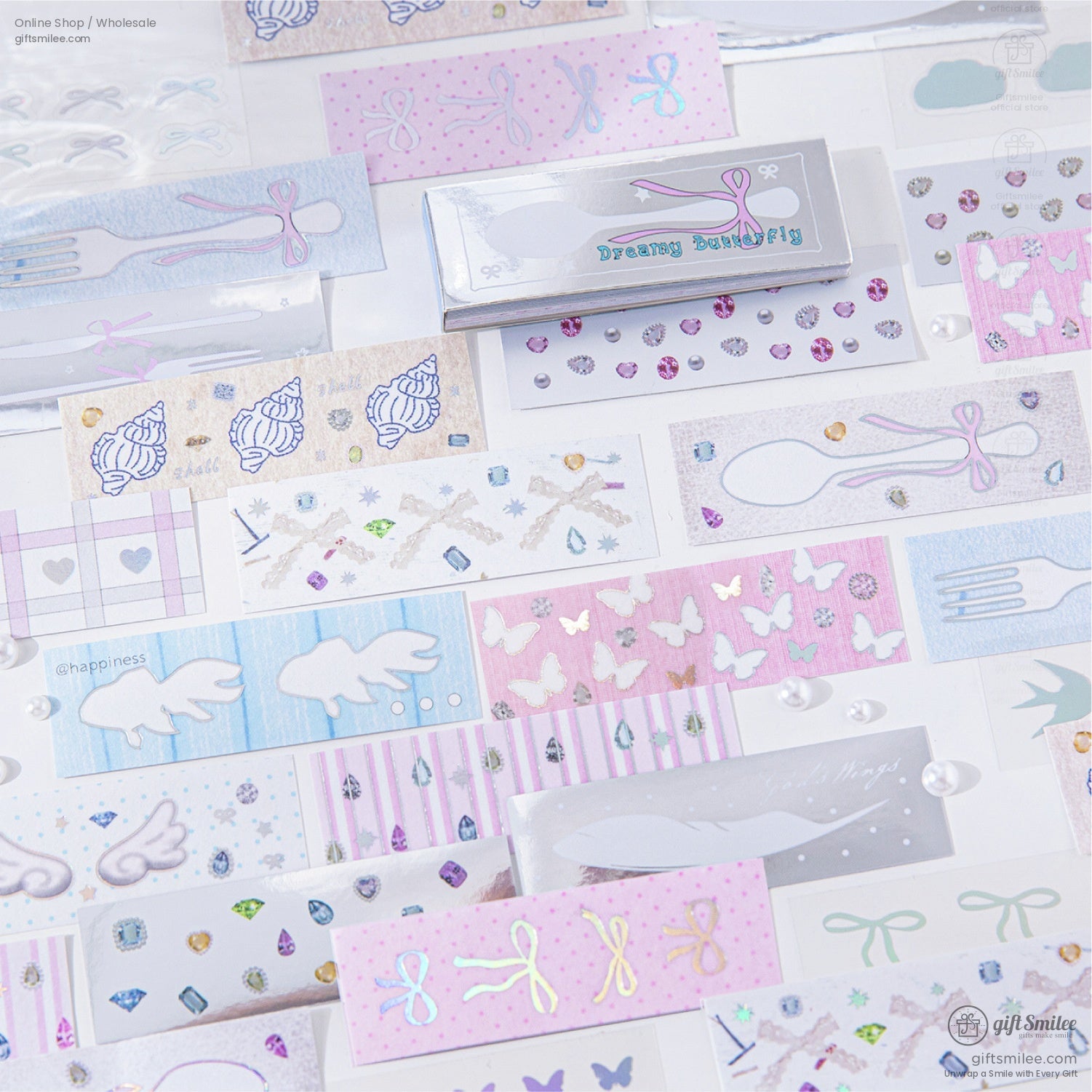 A flat lay of holographic stickers featuring stars, bows, and butterflies with sparkling accents