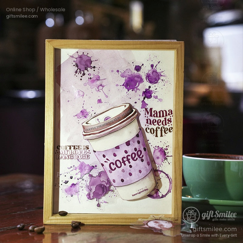 Framed coffee-themed artwork featuring a purple coffee cup design with splashes.
