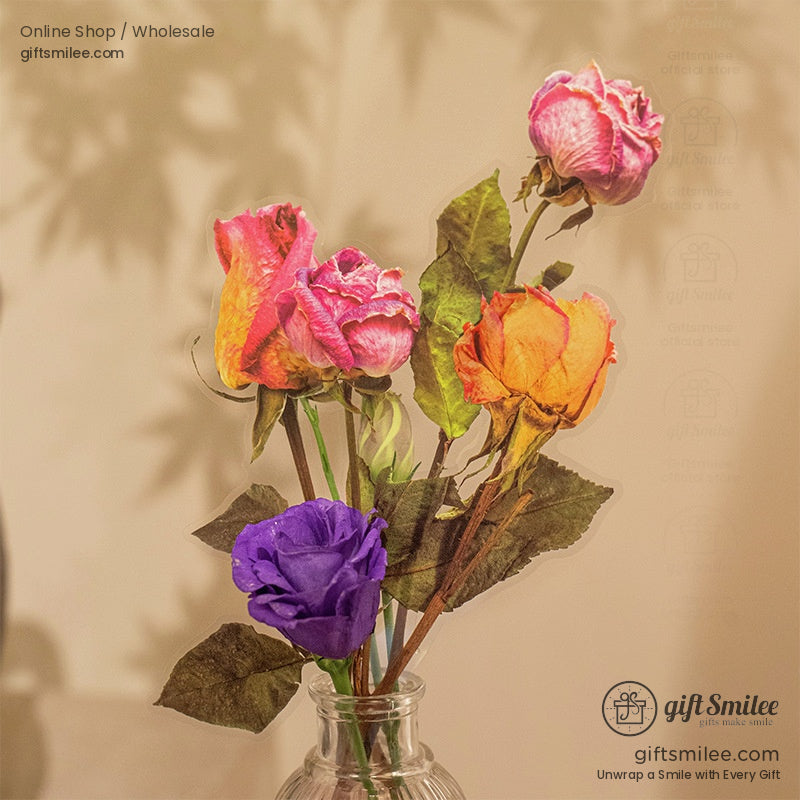 A vibrant bouquet of dried pressed rose stickers displayed in a glass vase