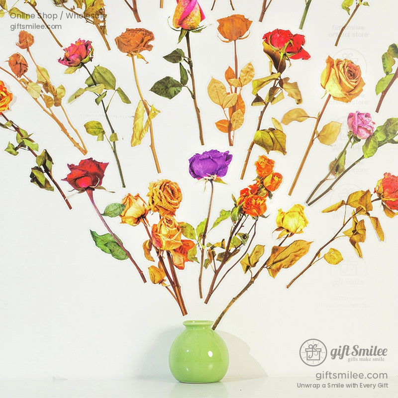 A collection of colorful pressed rose stickers arranged like a blooming tree on a white wall