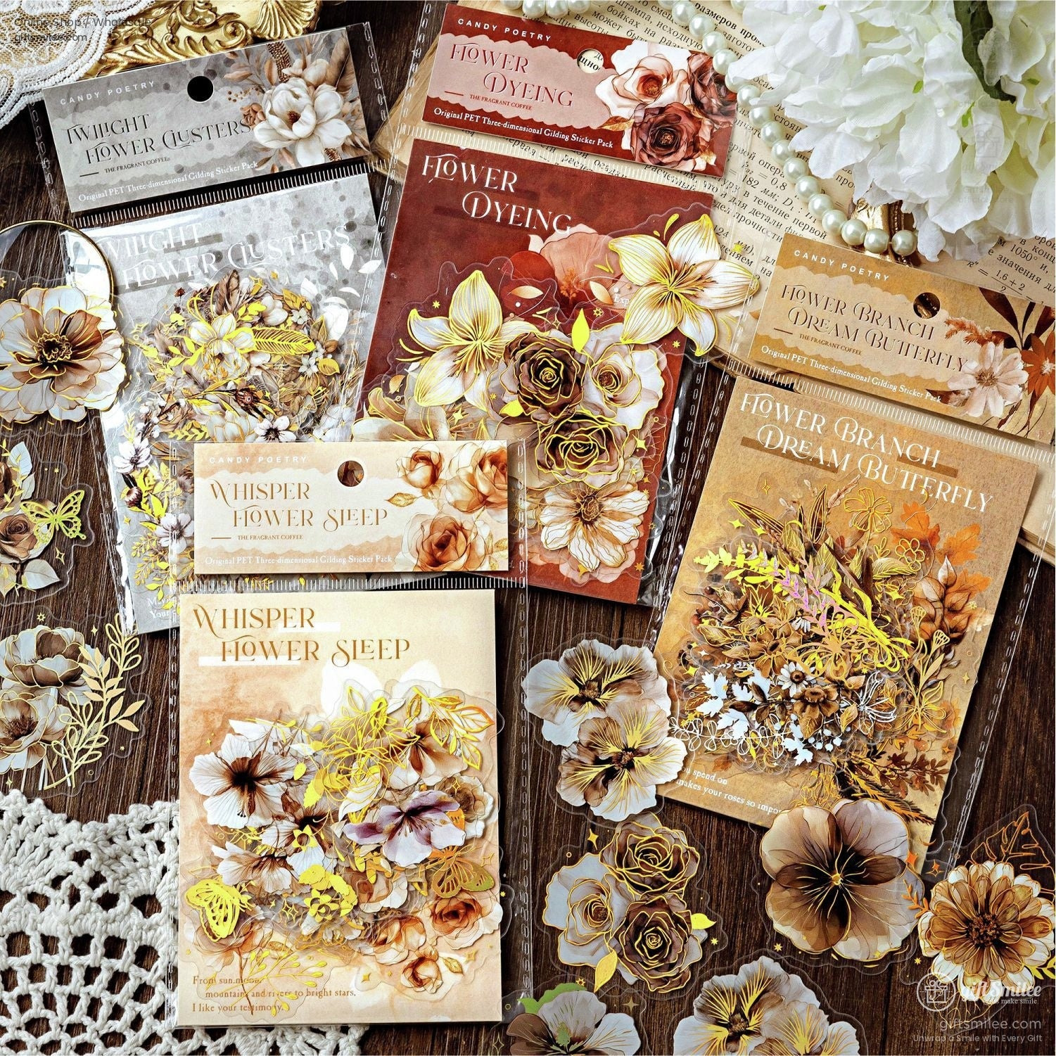 A collection of botanical sticker packs, showcasing intricate floral and butterfly designs in warm earth tones.