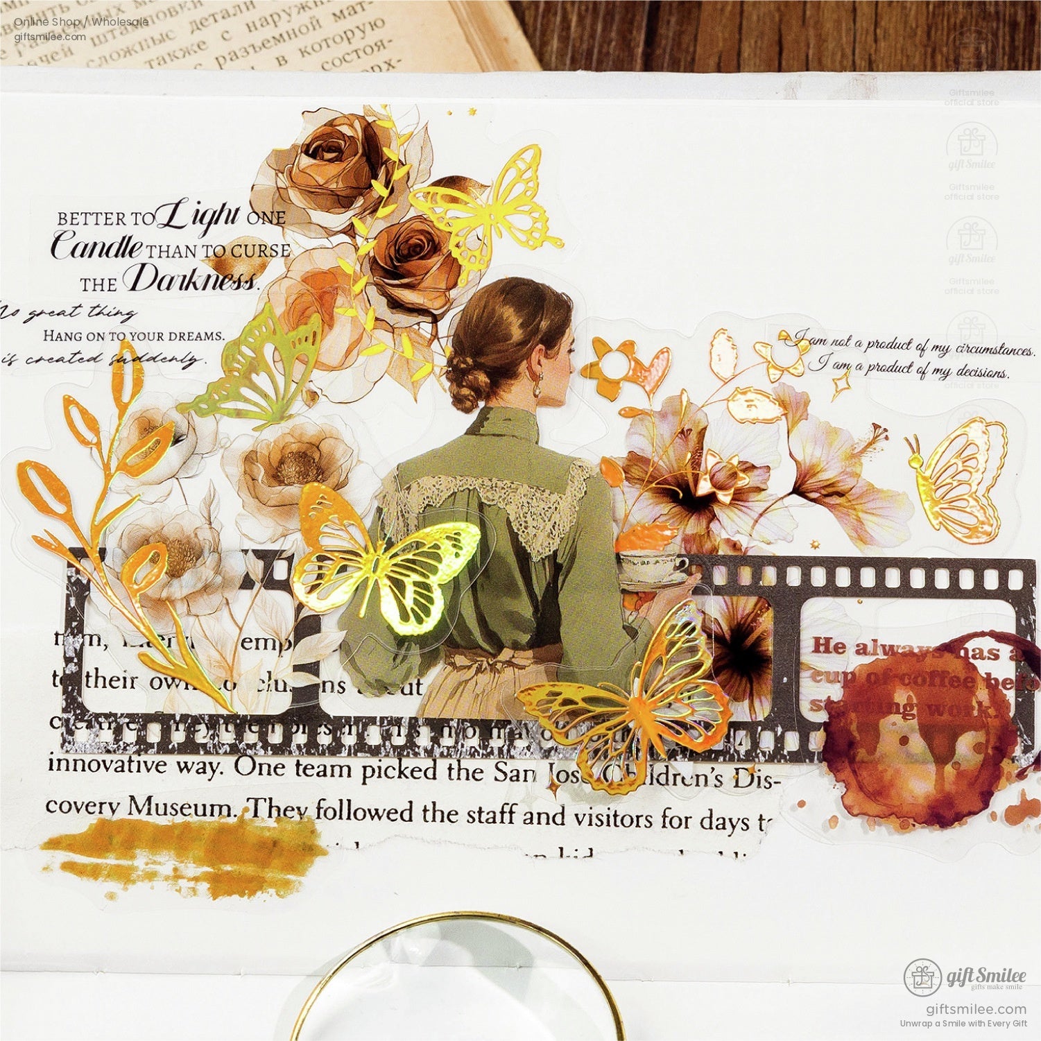 A creative journaling spread with botanical stickers, including flowers, golden butterflies, and retro accents.