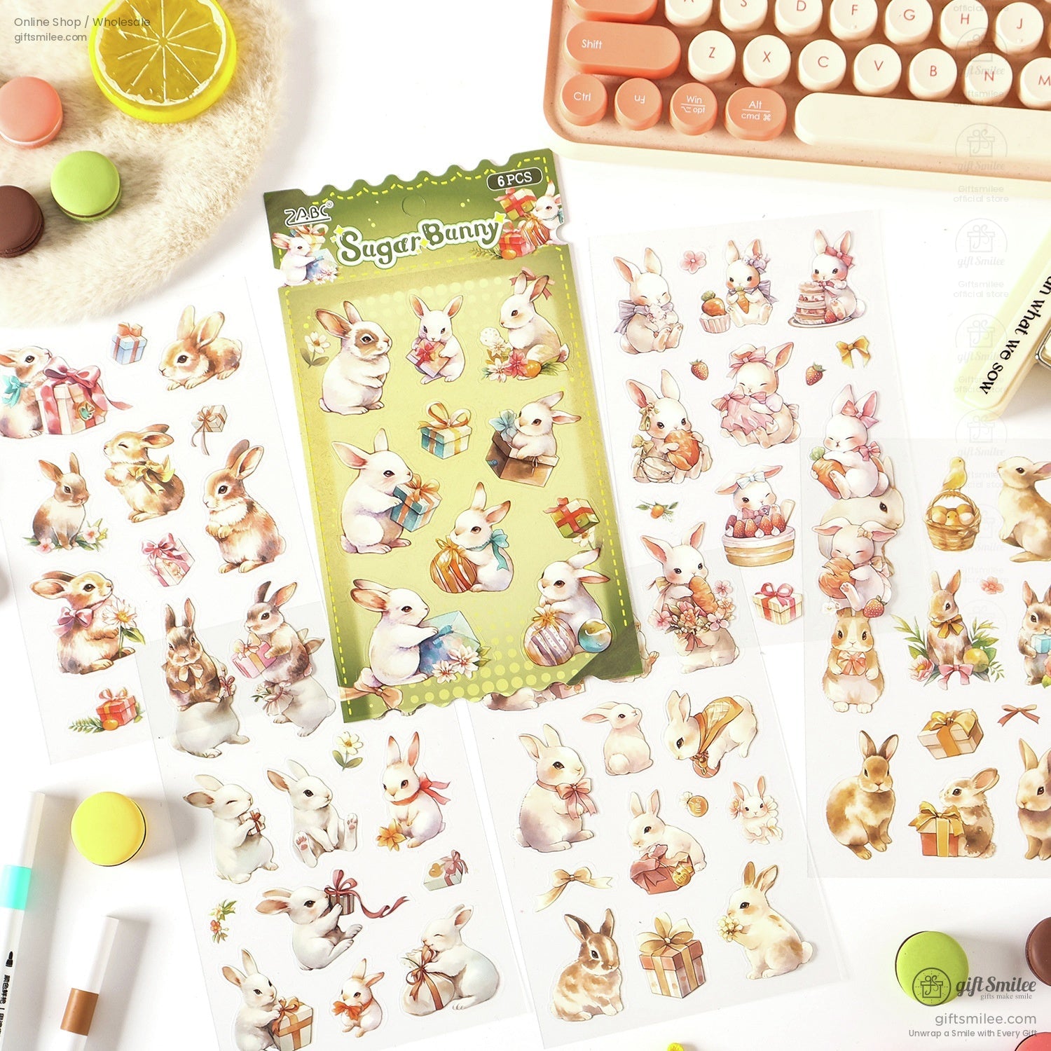 Close-up of adorable bunny-themed stickers with gift and floral designs, perfect for journaling