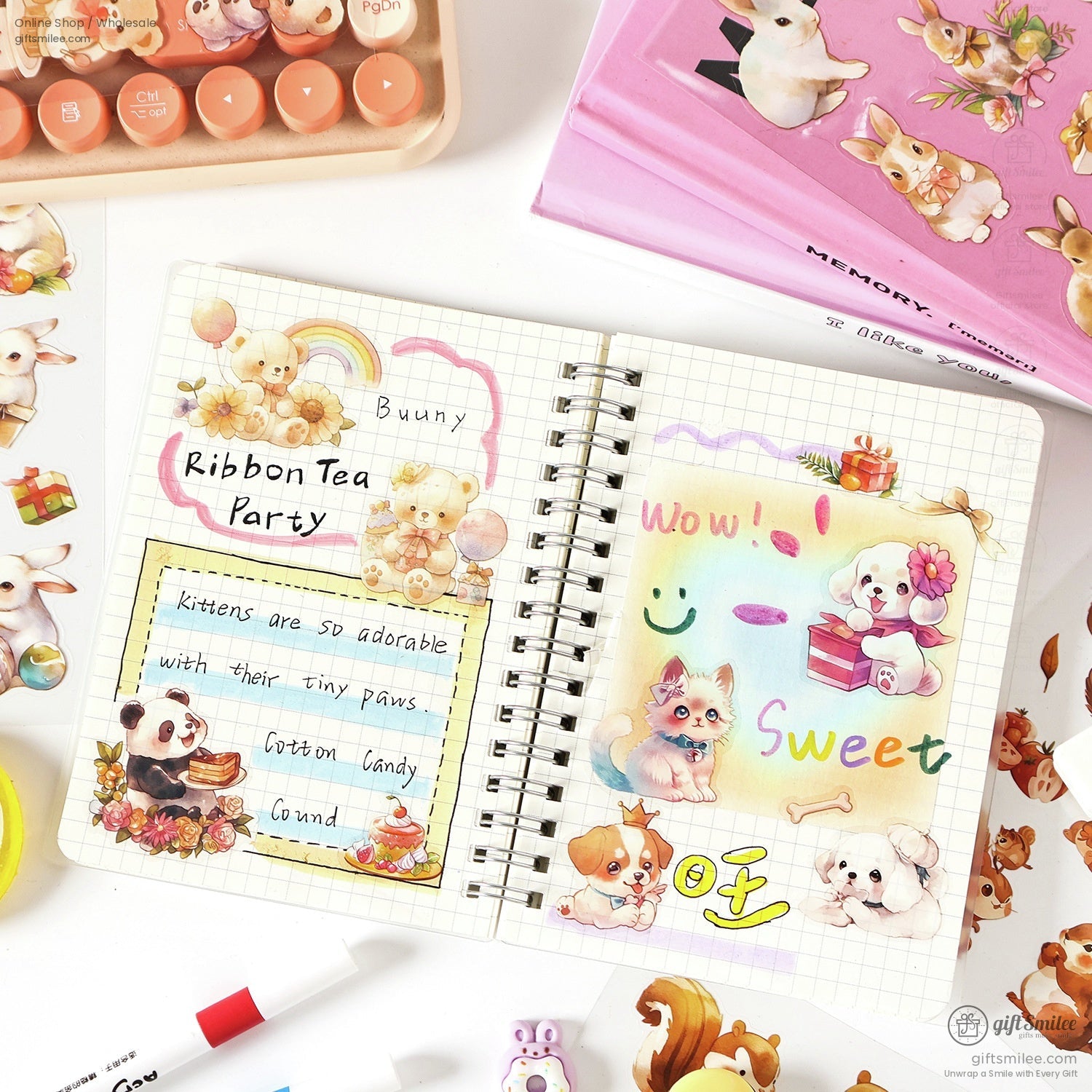 A journal spread decorated with cute animal stickers, including bears, pandas, and cats, alongside vibrant stationery