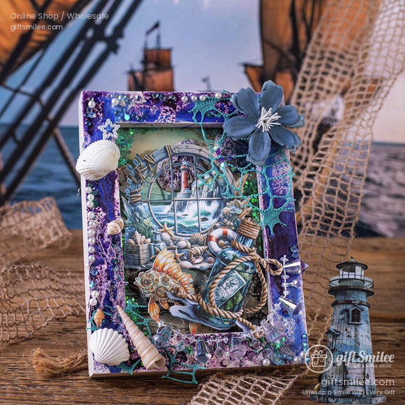 Nautical-themed scrapbook frame with seashells, lighthouse, and sea life embellishments