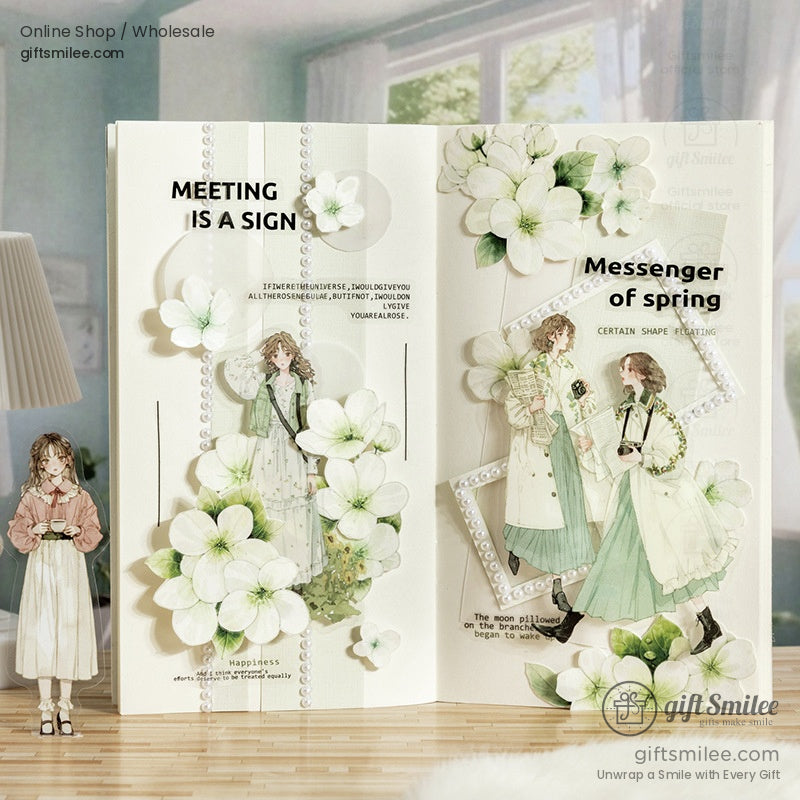 Vintage-themed scrapbook layout adorned with artistic girl stickers and floral designs