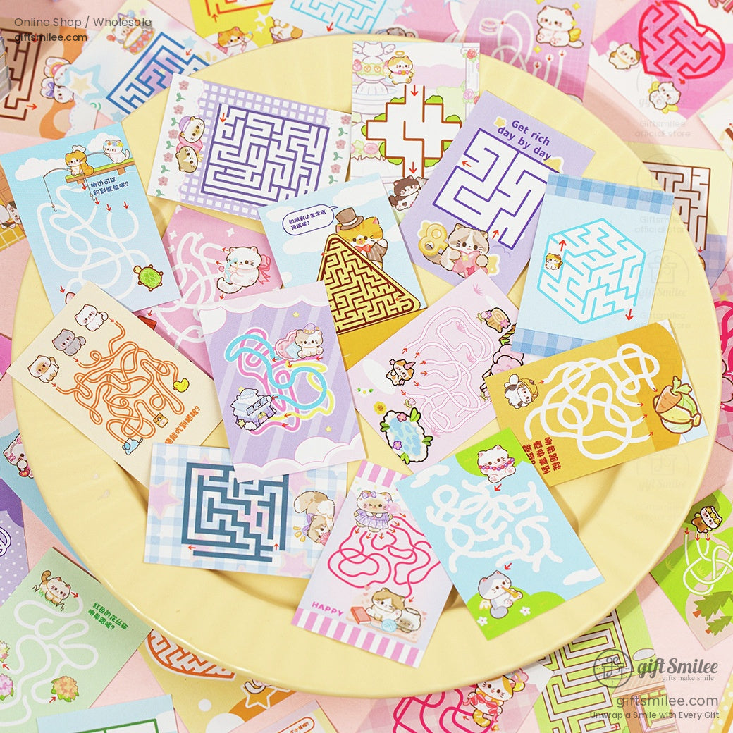 Various maze sheets with cute cat illustrations spread out on a yellow plate.