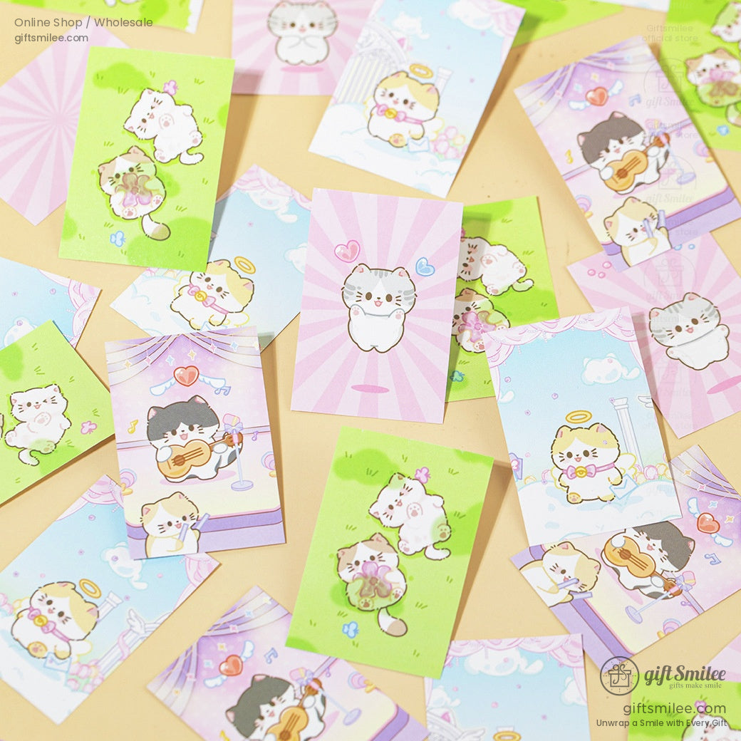 Spread of mini memo sheets with vibrant cat illustrations and pastel backgrounds.