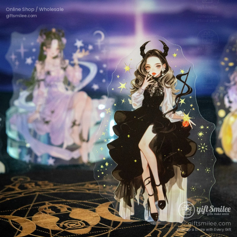 Close-up of acrylic fantasy sticker featuring a celestial maiden in black with golden stars and horns