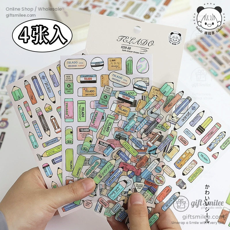 Close-up of hands holding retro pencil and eraser stickers for scrapbooking and journaling