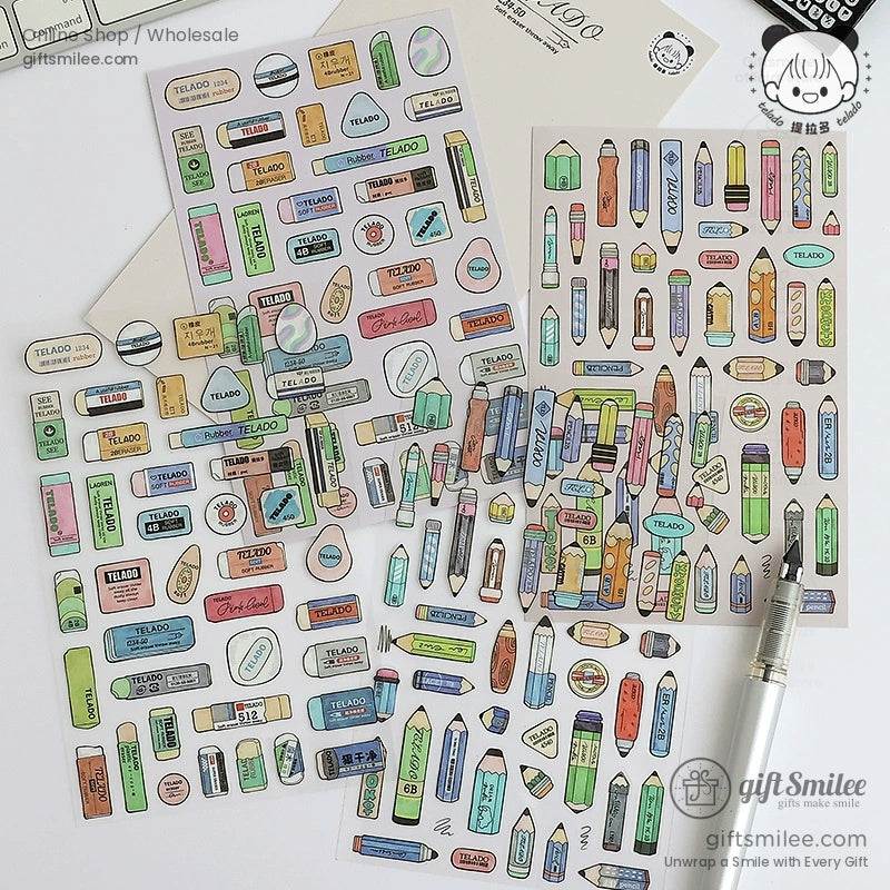 A variety of stationery-inspired stickers spread across a table, showcasing detailed designs