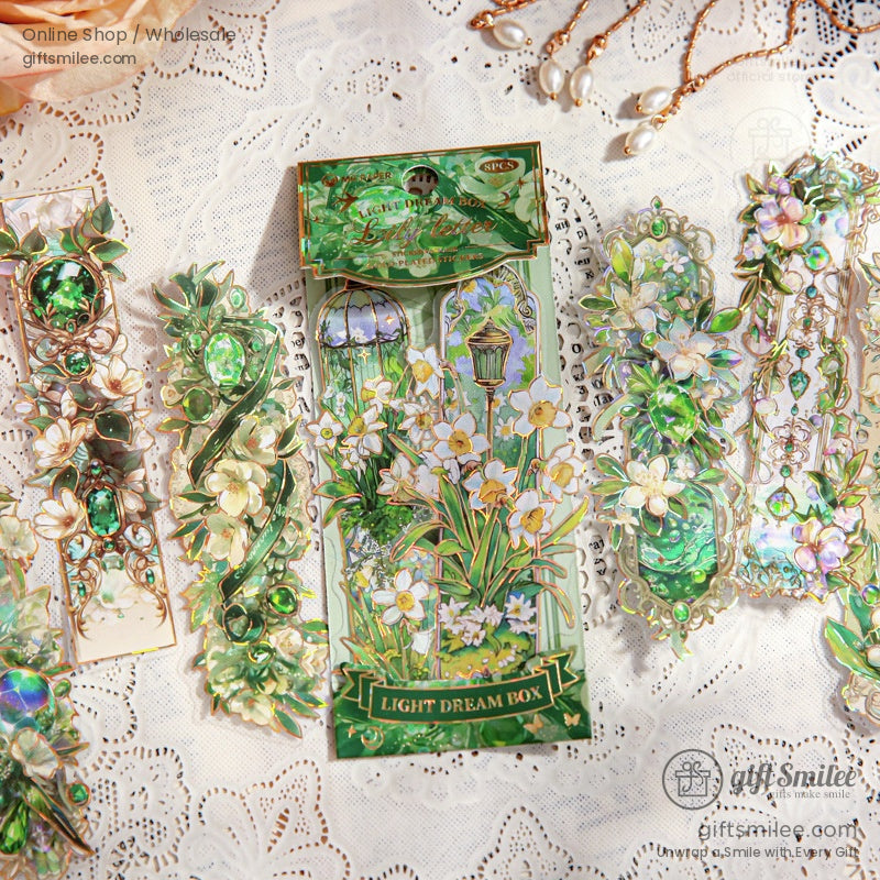 Elegant gold foil floral stickers featuring vintage designs on a decorative plate