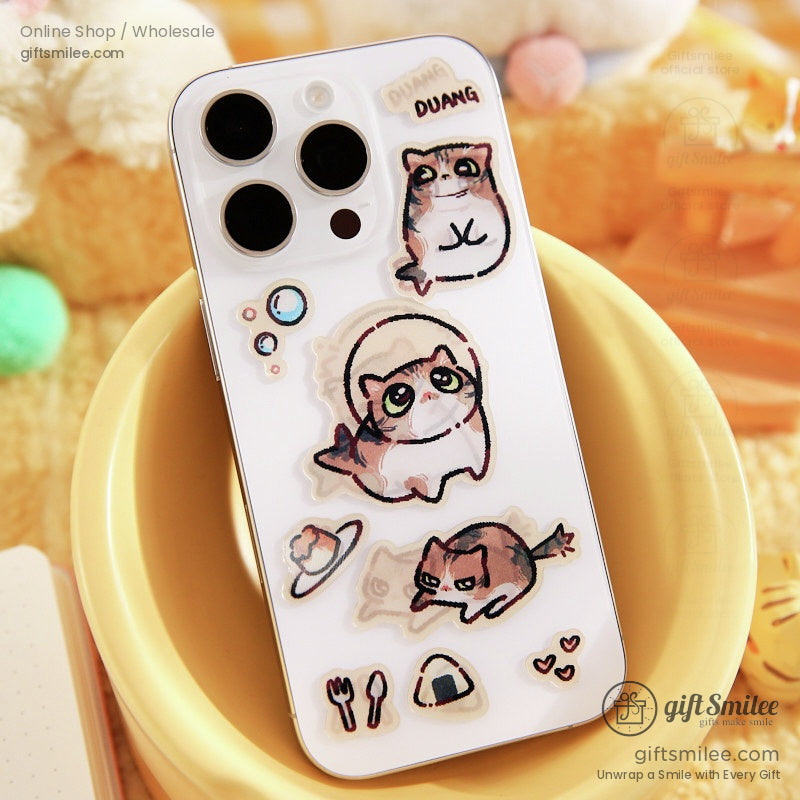 Phone decorated with kawaii cat grating stickers, adding charm to a white smartphone