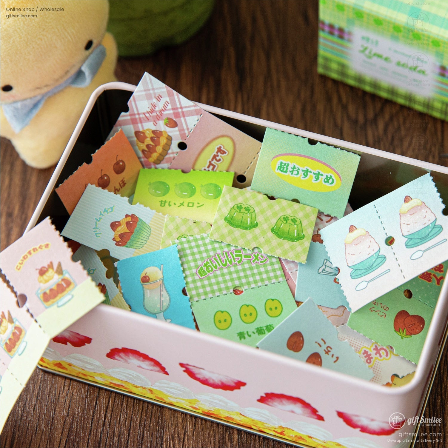 Close-up of a pastel-colored tin filled with retro cafe-inspired stickers depicting desserts and drinks