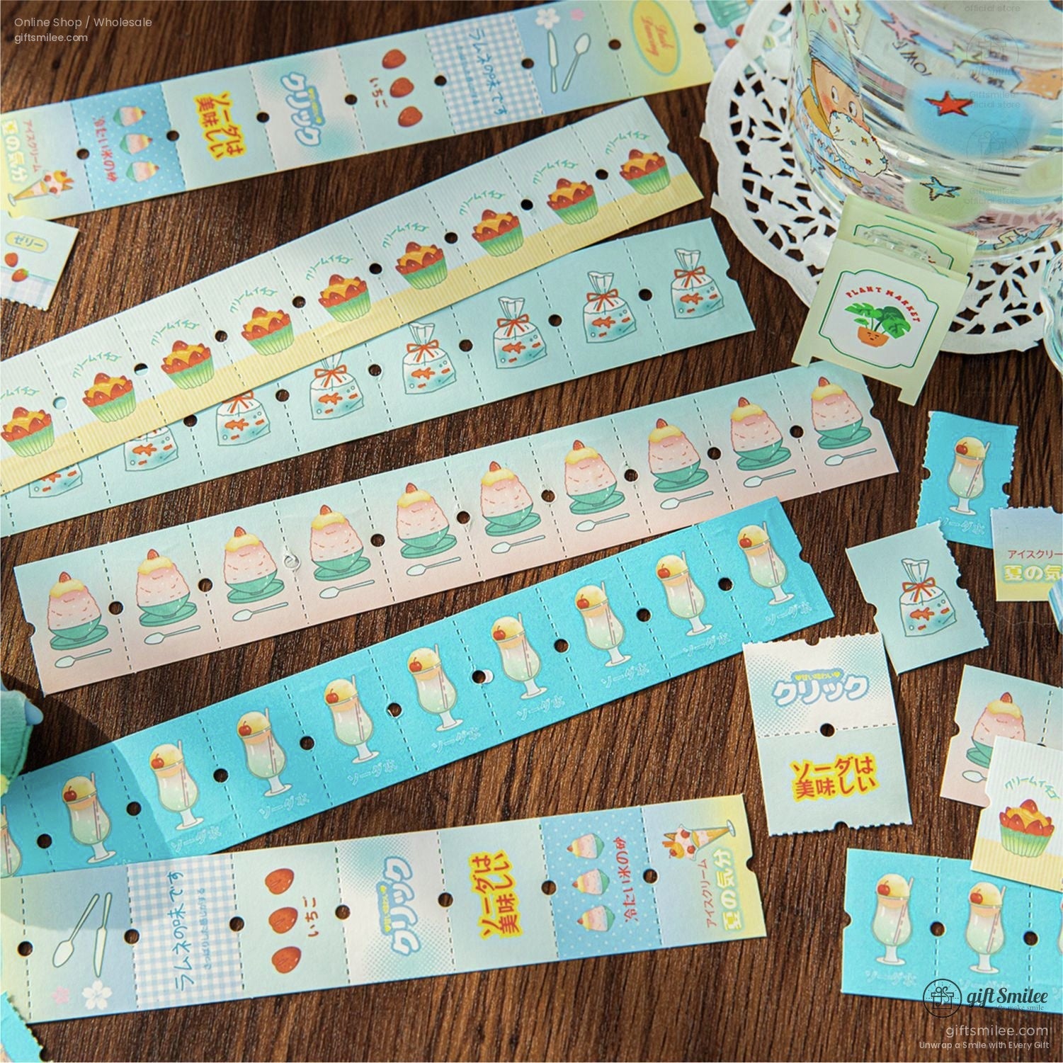 Blue and pastel-themed stickers with desserts and beverages arranged neatly on a wooden surface